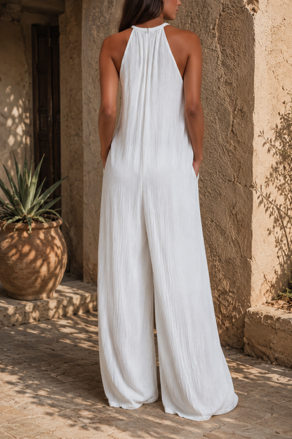 Elegante mono sin mangas con pantalón palazzo.